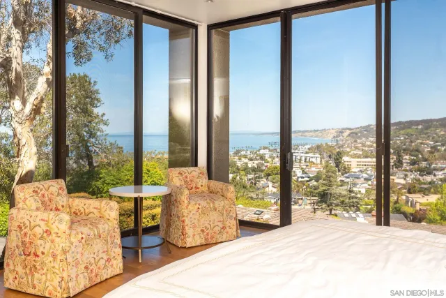a view of a bedroom with windows