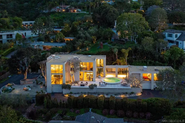 an aerial view of a house with swimming pool yard and outdoor seating