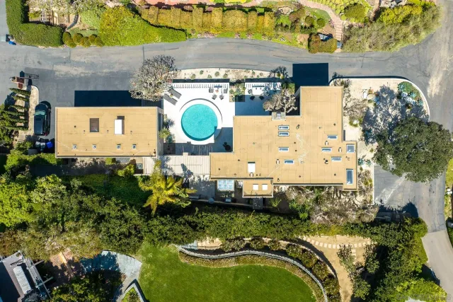 an aerial view of a house with swimming pool