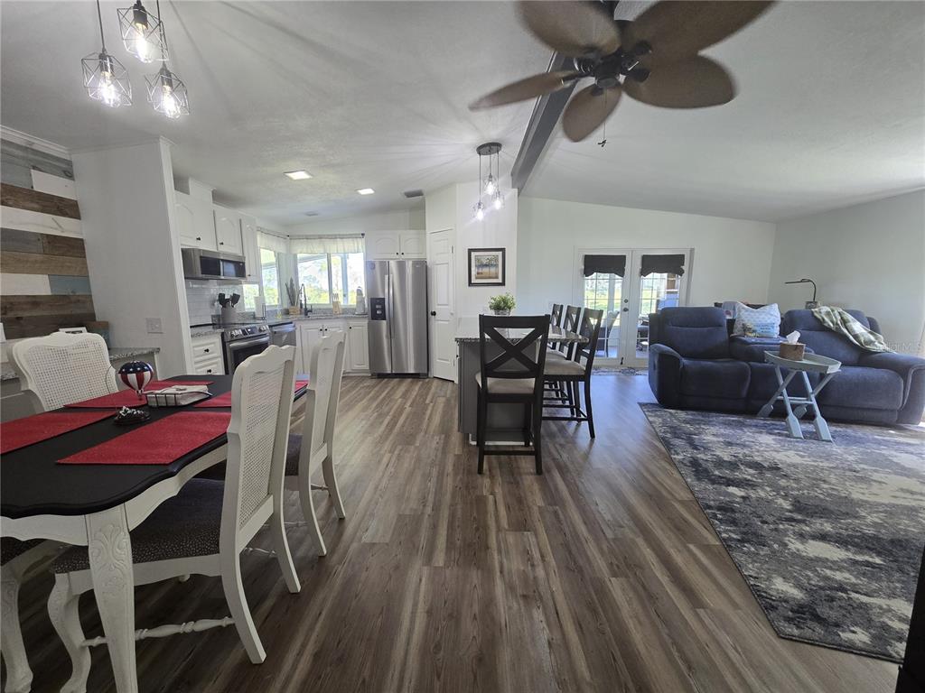 3935 Parway Road, Unit 1322 Zellwood, FL 32798 - Photo 11 of 28 a living room with furniture and a wooden floor