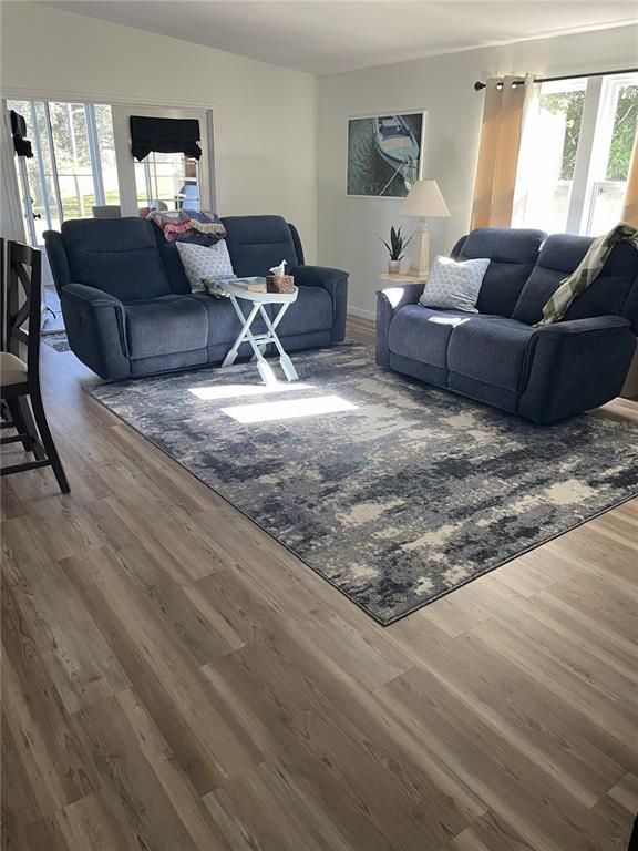 3935 Parway Road, Unit 1322 Zellwood, FL 32798 - Photo 12 of 28 a living room with a couch and a window