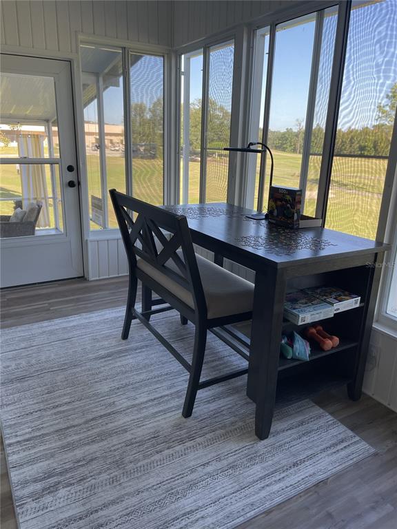 3935 Parway Road, Unit 1322 Zellwood, FL 32798 - Photo 13 of 28 a view of a dining room with furniture window and wooden floor