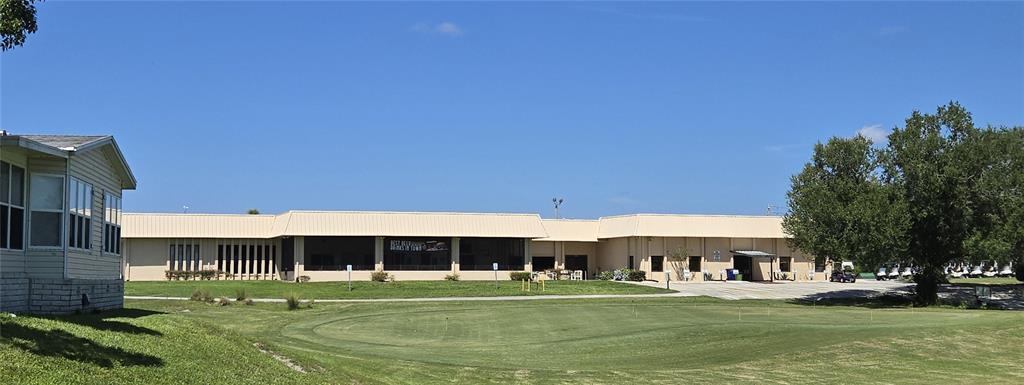 3935 Parway Road, Unit 1322 Zellwood, FL 32798 - Photo 18 of 28 a big room with a big yard and large trees