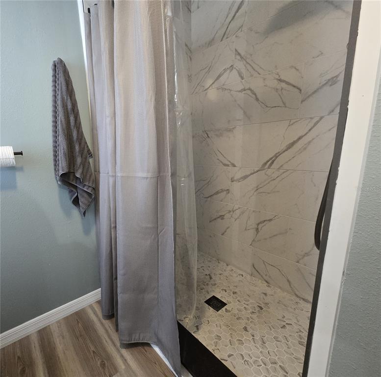 3935 Parway Road, Unit 1322 Zellwood, FL 32798 - Photo 24 of 28 a bathroom with a shower