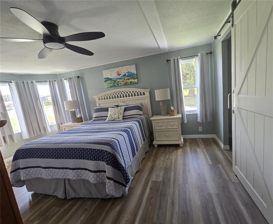 3935 Parway Road, Unit 1322 Zellwood, FL 32798 - Photo 26 of 28 a bedroom with a bed and a large window
