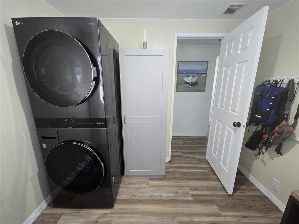 3935 Parway Road, Unit 1322 Zellwood, FL 32798 - Photo 5 of 28 a view of a hallway with washer and dryer