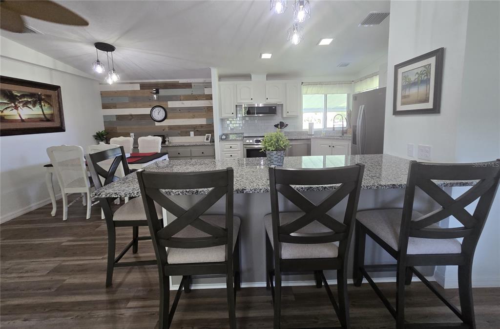 3935 Parway Road, Unit 1322 Zellwood, FL 32798 - Photo 7 of 28 a dining room with furniture and window