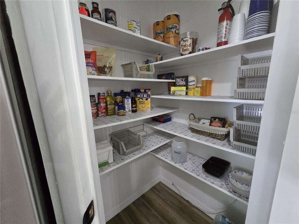 3935 Parway Road, Unit 1322 Zellwood, FL 32798 - Photo 9 of 28 a shelf with cup and plates