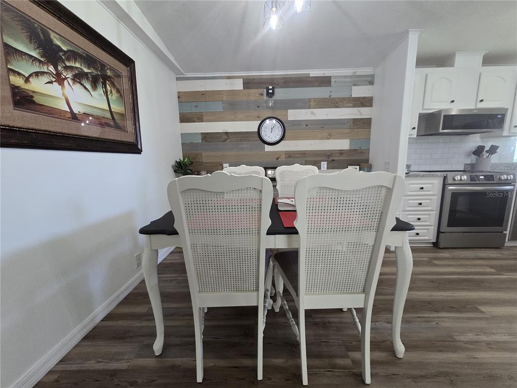 3935 Parway Road, Unit 1322 Zellwood, FL 32798 - Photo 10 of 28 a dining room with furniture and window