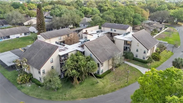 an aerial view of a house with outdoor space
