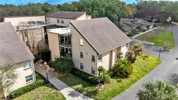 a aerial view of a house with a yard