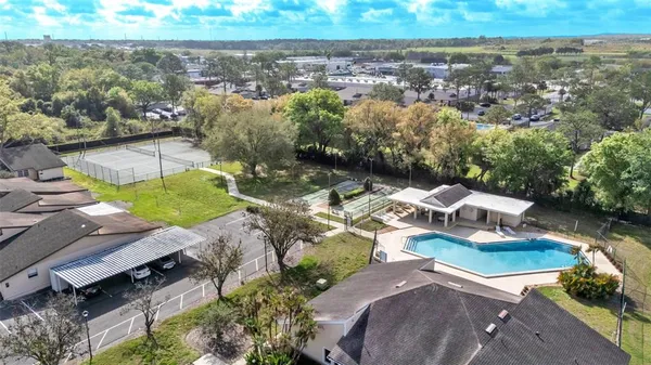 an aerial view of residential houses with outdoor space