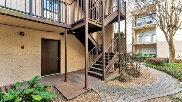 a view of a house with a bench