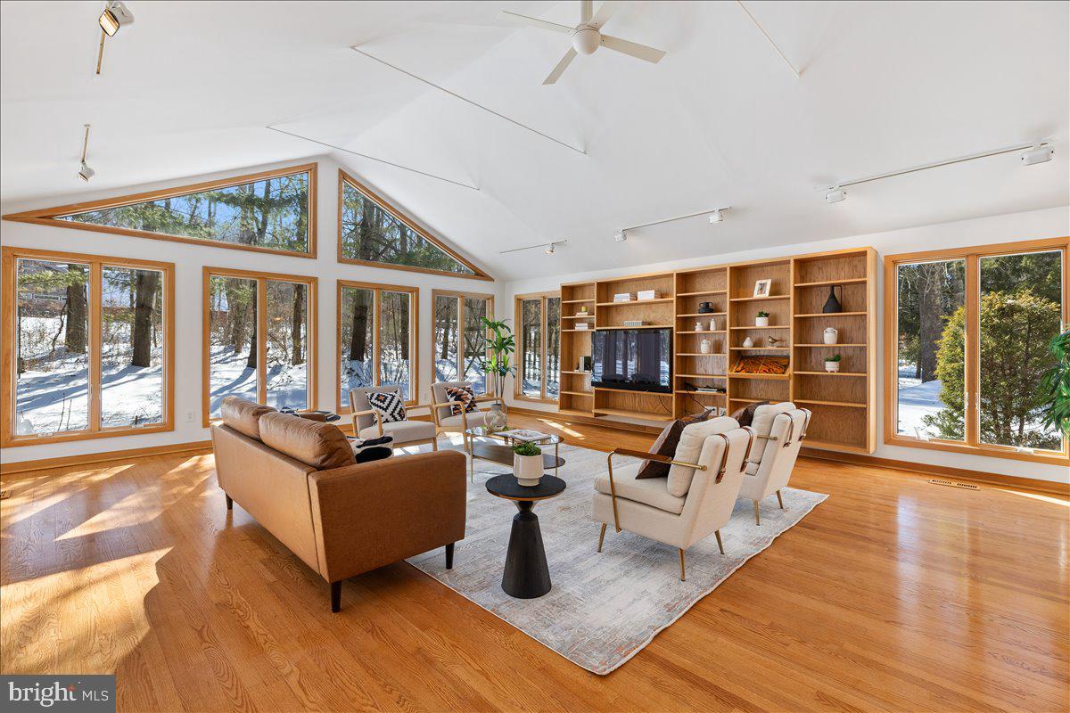 165 Heather Lane Princeton, NJ 08540 - Photo 11 of 28 a living room with fireplace furniture and a large window