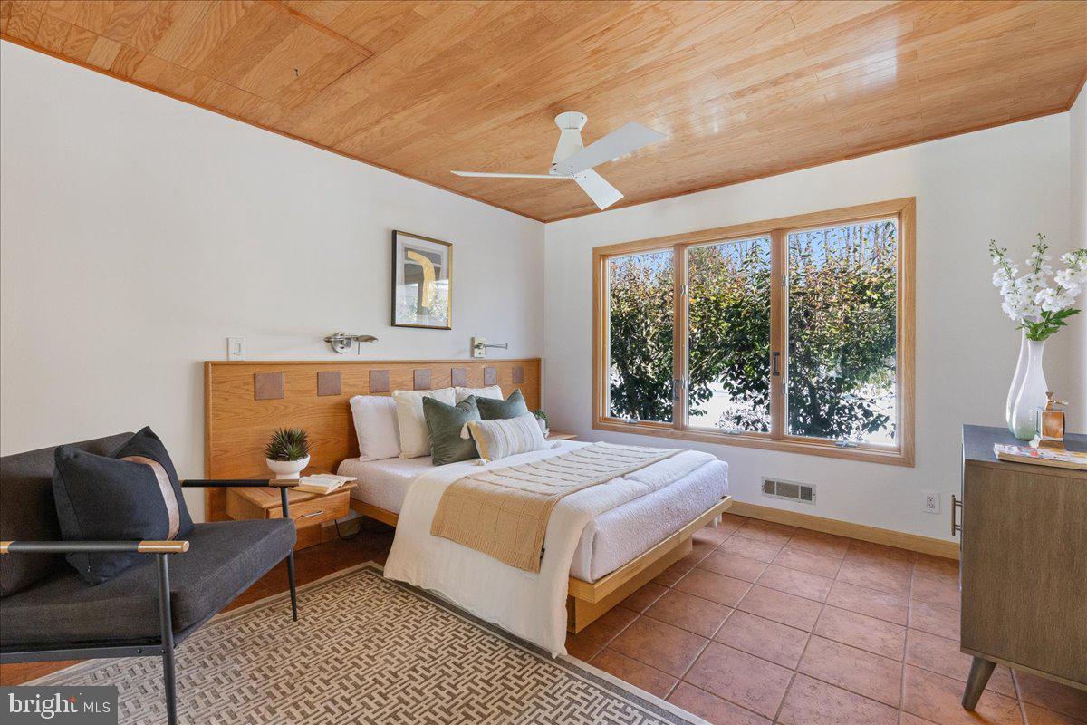 165 Heather Lane Princeton, NJ 08540 - Photo 15 of 28 a bed room with a bed and a chair