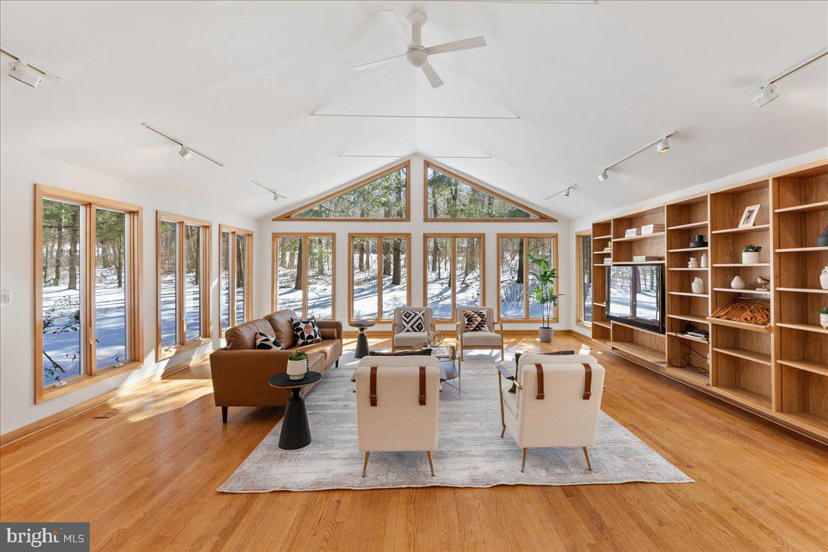 165 Heather Lane Princeton, NJ 08540 - Photo 10 of 28 a living room with furniture large window and flat screen tv