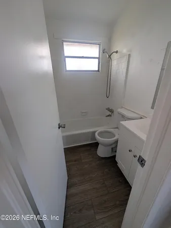 a bathroom with a toilet and a sink