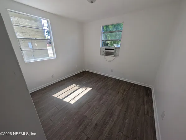 an empty room with windows