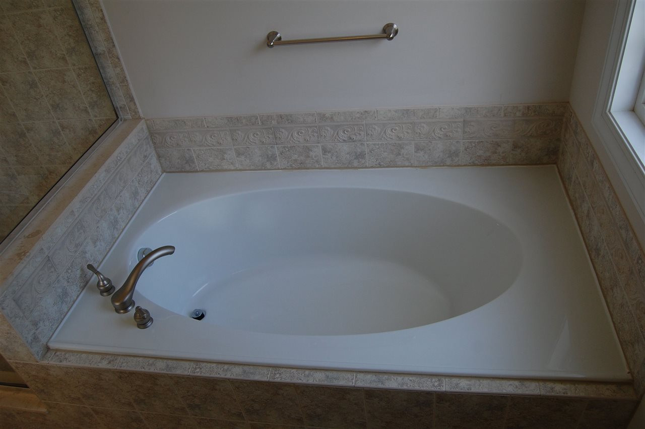 840 Nowell Ridge Road Raleigh, NC 27607 - Photo 14 of 25 MBA Garden tub close up view showing tub, tile work & fixtures! Master Bath/Spa