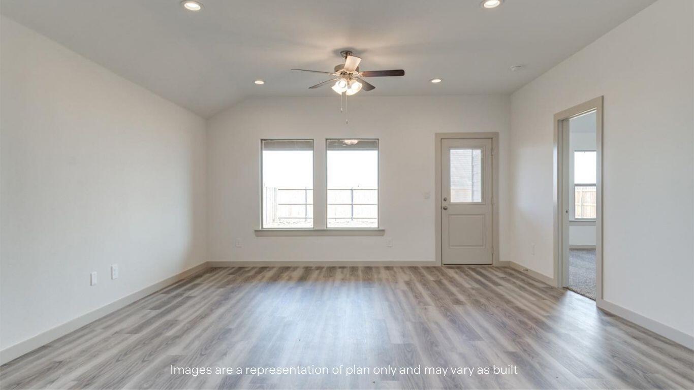 2234 150th Place Lubbock, TX 79423 - Photo 11 of 22 a view of an empty room with wooden floor and a window