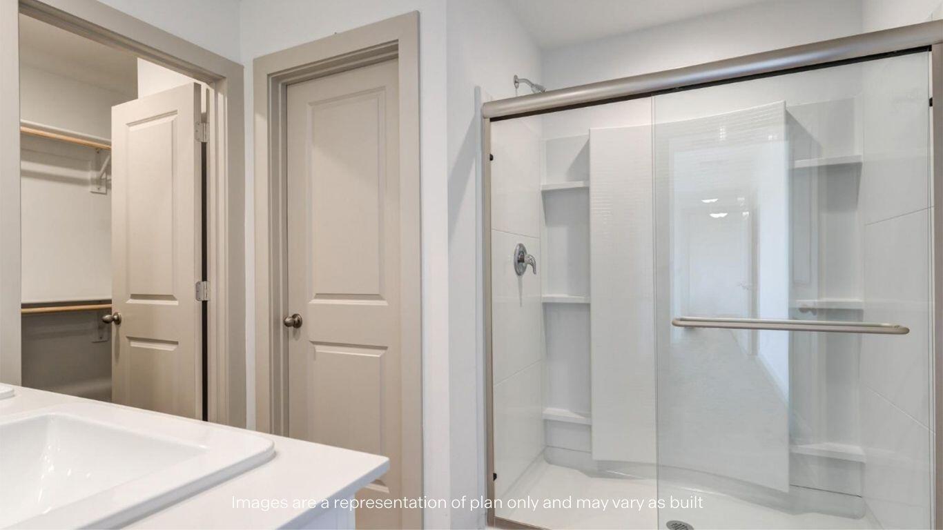 2234 150th Place Lubbock, TX 79423 - Photo 15 of 22 a view of a bathroom with a shower and a sink