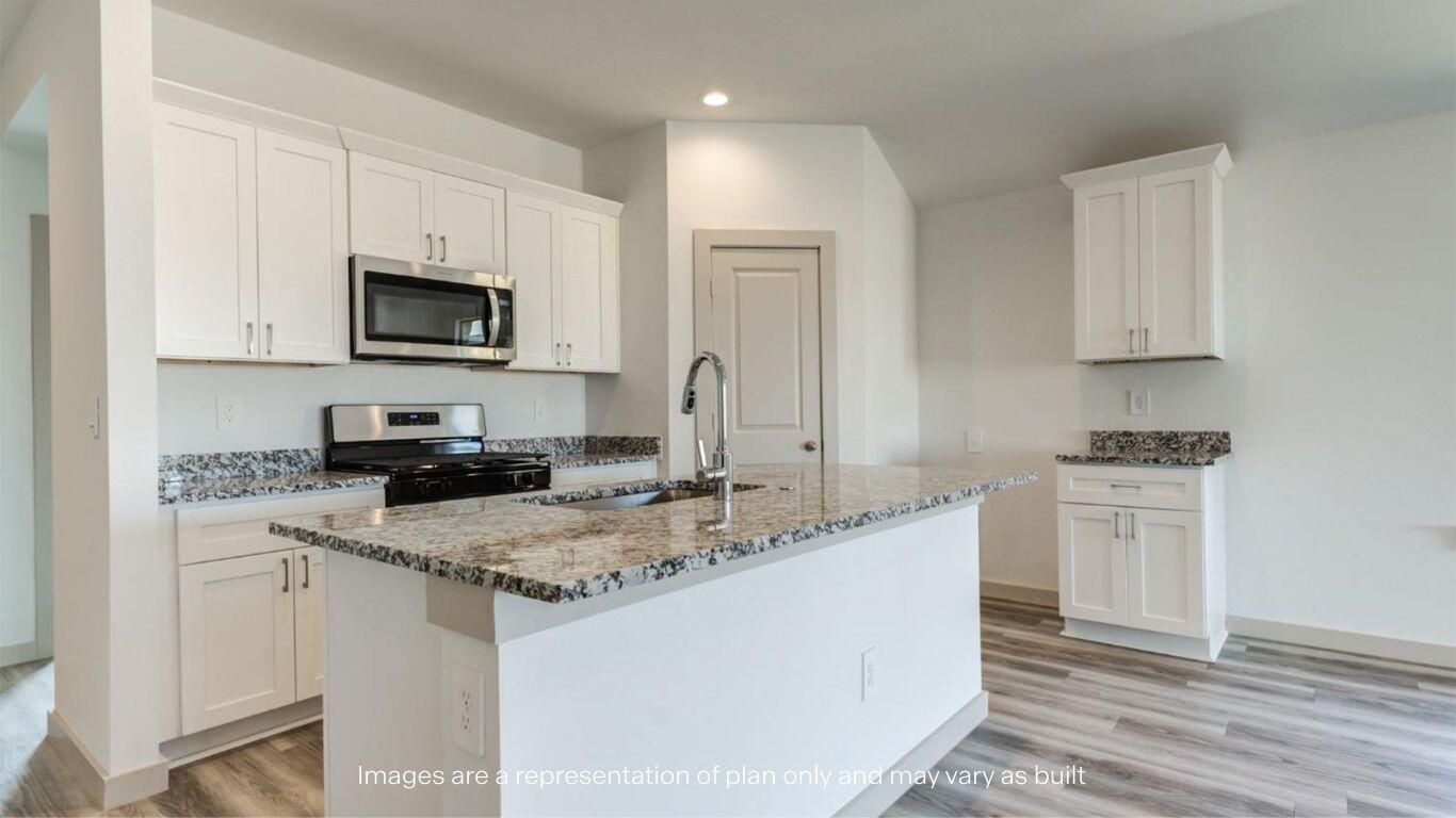 2234 150th Place Lubbock, TX 79423 - Photo 3 of 22 a kitchen with appliances a sink and a stove