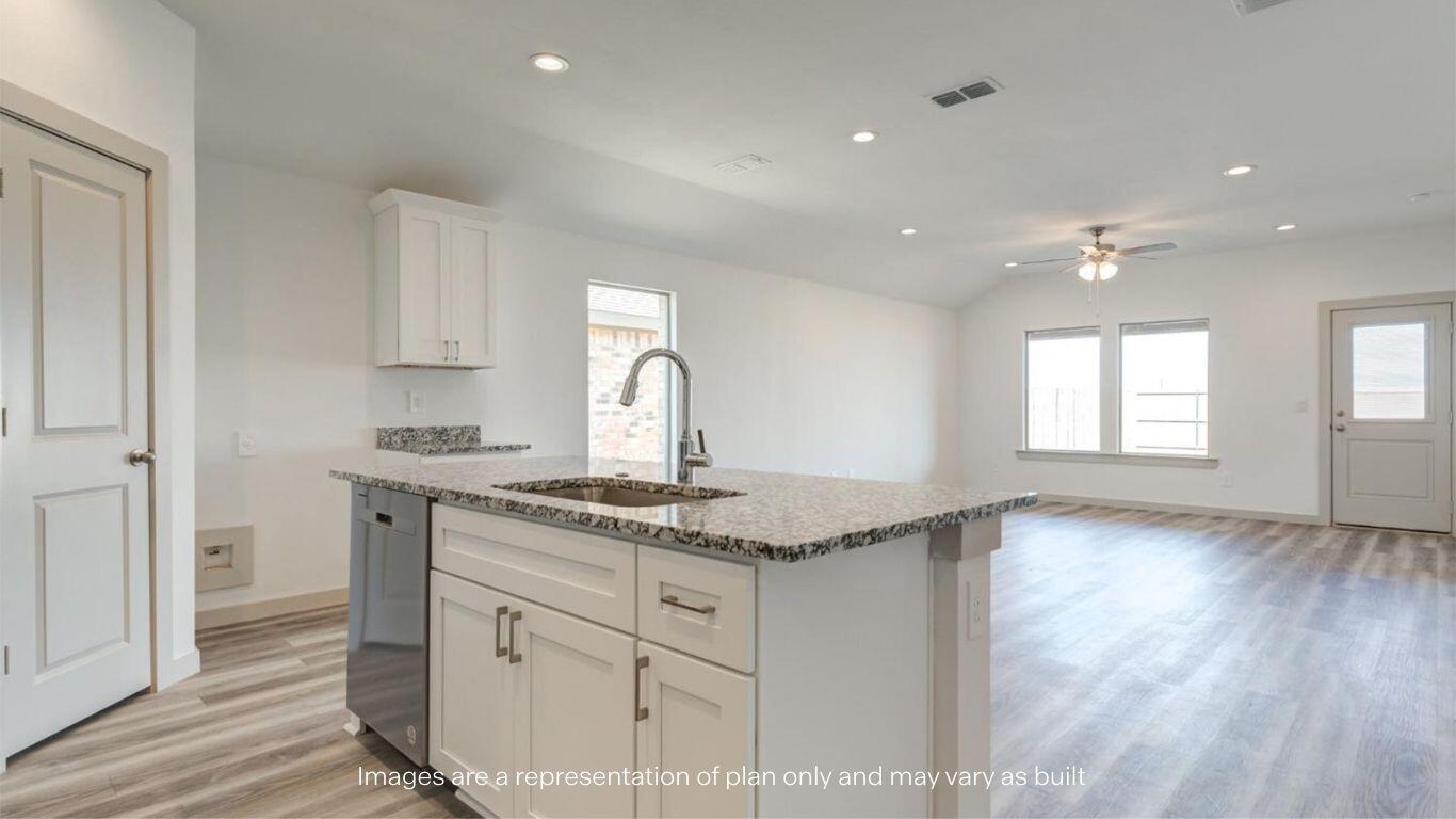 2234 150th Place Lubbock, TX 79423 - Photo 5 of 22 a kitchen with stainless steel appliances granite countertop a sink and a stove top oven