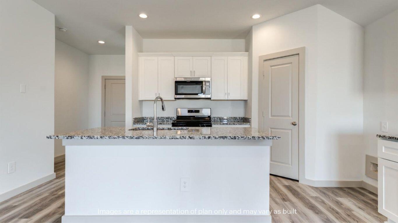 2234 150th Place Lubbock, TX 79423 - Photo 6 of 22 a kitchen with stainless steel appliances granite countertop a sink a stove and a refrigerator