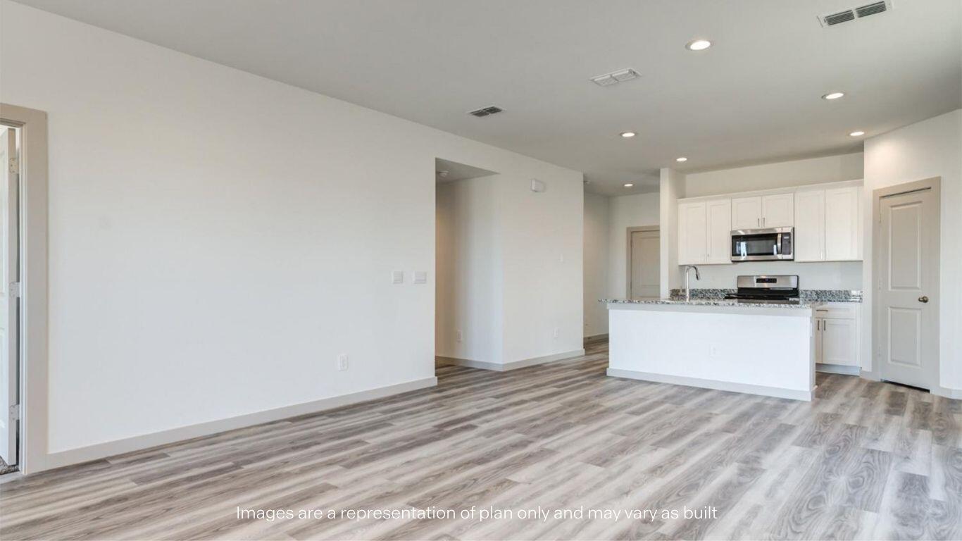 2234 150th Place Lubbock, TX 79423 - Photo 8 of 22 a large kitchen with kitchen island a sink wooden floor and stainless steel appliances