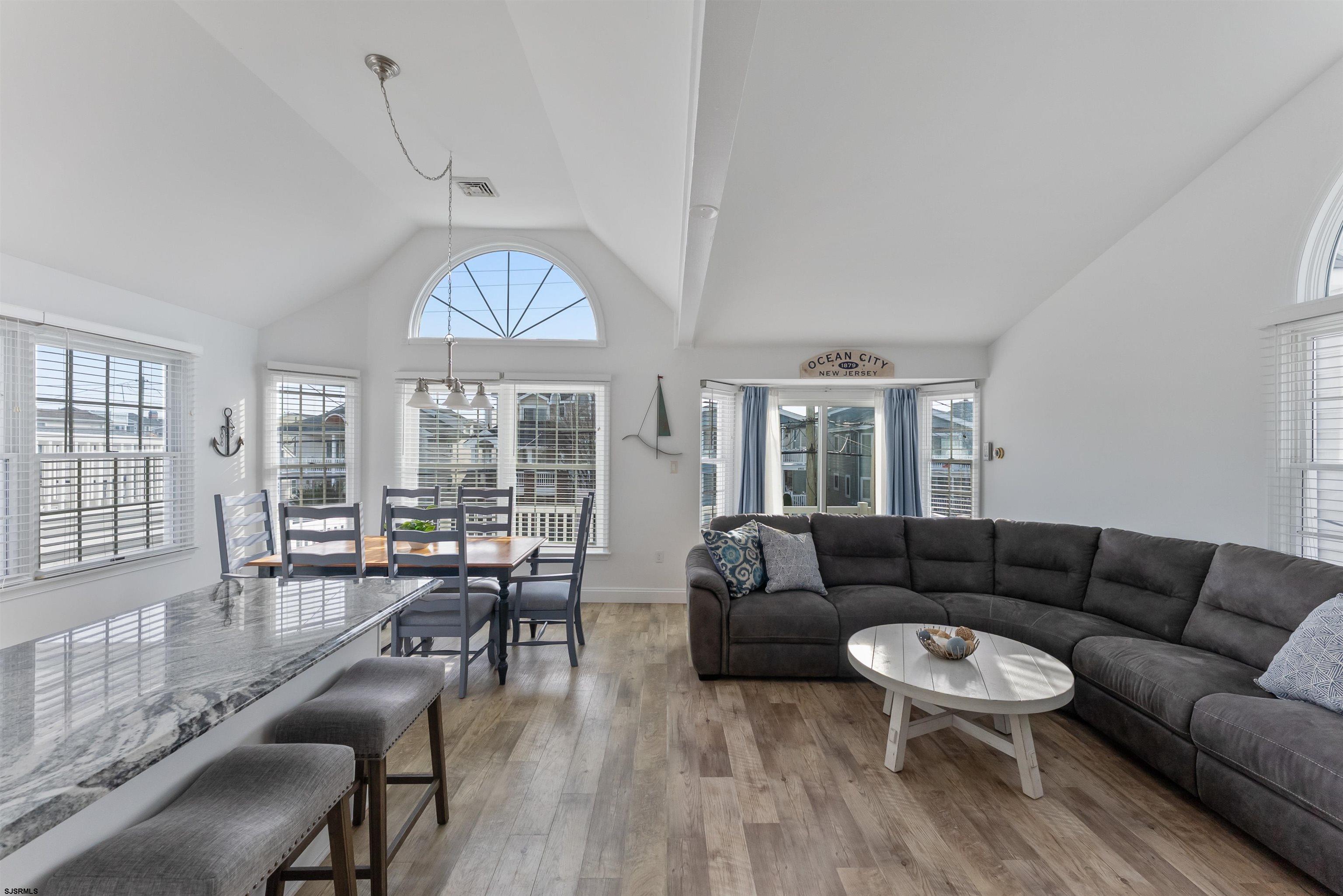 4930 Asbury Avenue, Unit 2 Ocean City, NJ 08226 - Photo 3 of 25 a living room with furniture and a large window