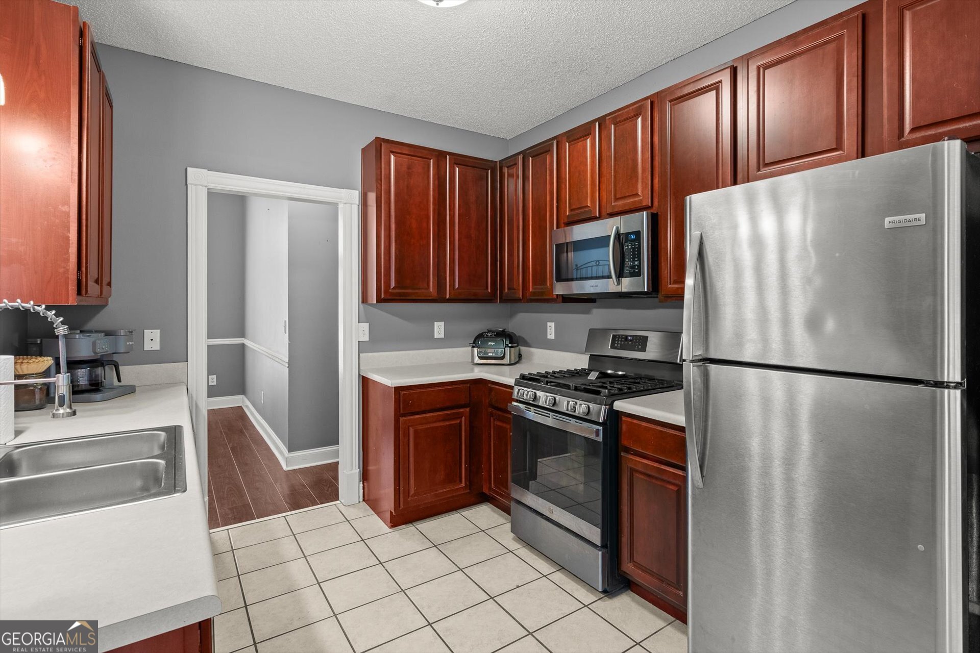 238 James Allen Place Temple, GA 30179 - Photo 14 of 43 a kitchen with stainless steel appliances granite countertop a refrigerator stove a sink and dishwasher