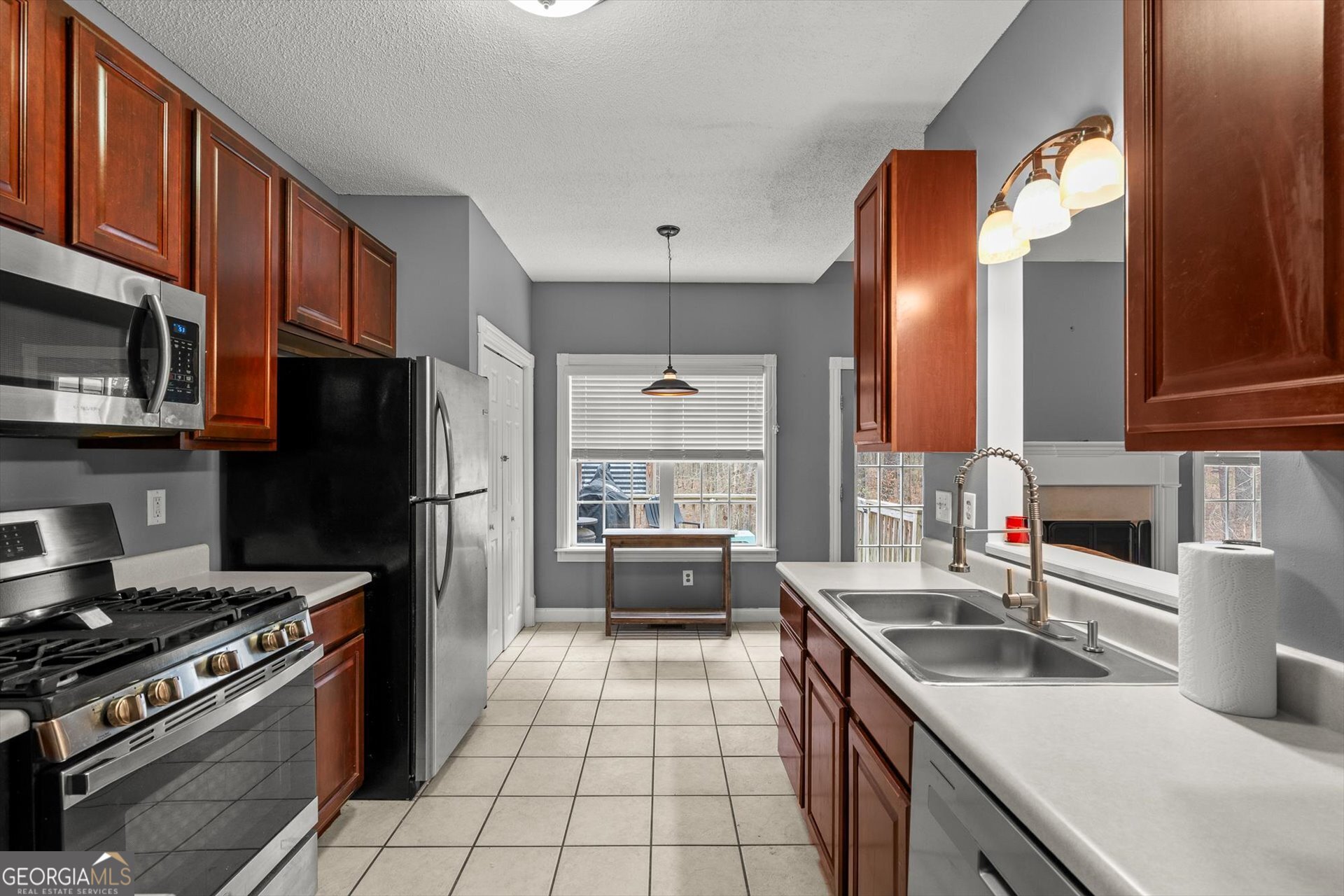 238 James Allen Place Temple, GA 30179 - Photo 17 of 43 a kitchen with stainless steel appliances a sink dishwasher stove and refrigerator