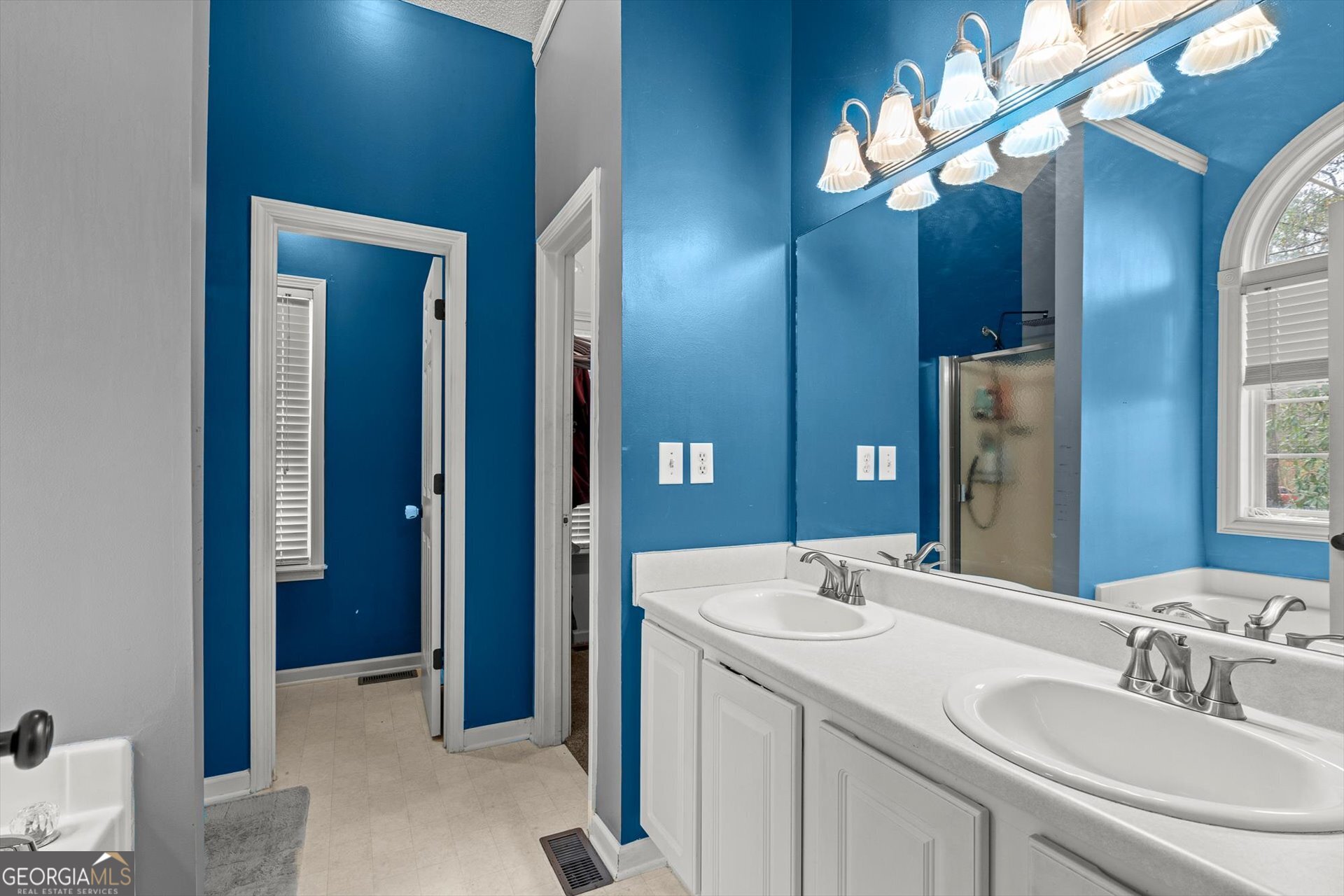 238 James Allen Place Temple, GA 30179 - Photo 22 of 43 a bathroom with a double vanity sink and a mirror