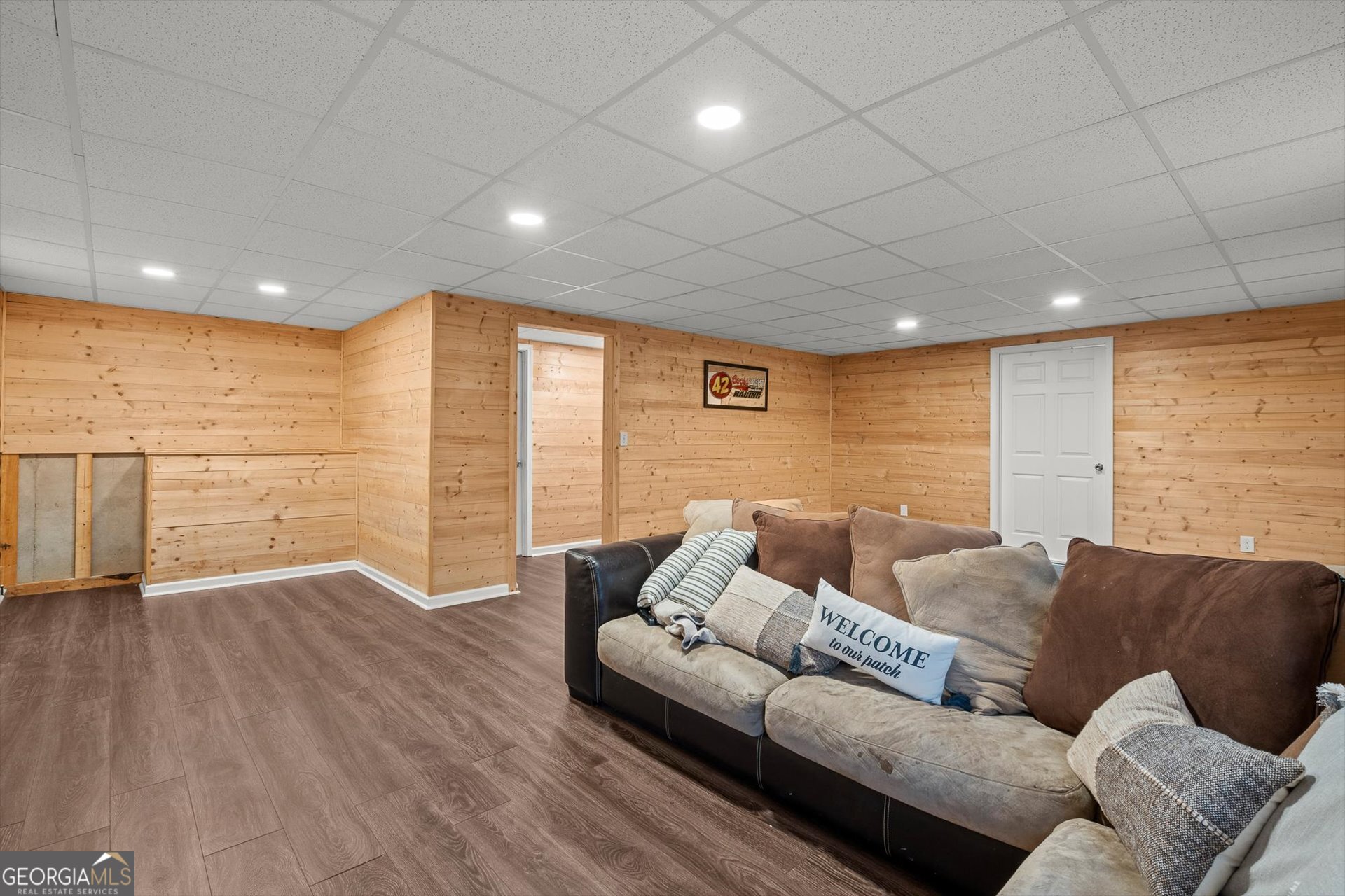 238 James Allen Place Temple, GA 30179 - Photo 34 of 42 a living room with couches and painted walls with wooden floor