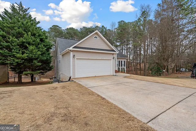 a view of garage and yard