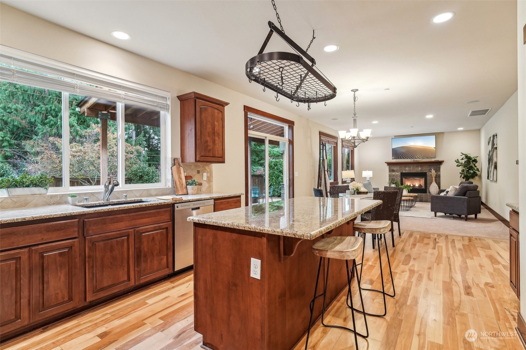3122 223rd Street Southeast Bothell, WA 98021 - Photo 8 of 36 a view of a kitchen counter space with wooden floor and windows