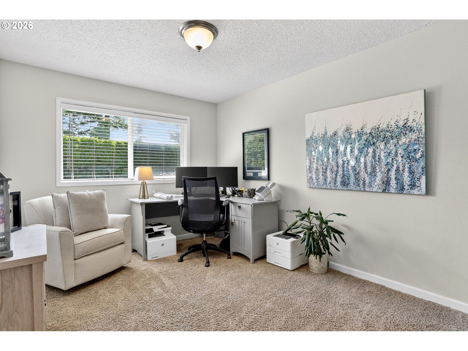 1776 Southeast 114th Place Portland, OR 97216 - Photo 39 of 47 a living room with furniture a computer on a desk and a potted plant