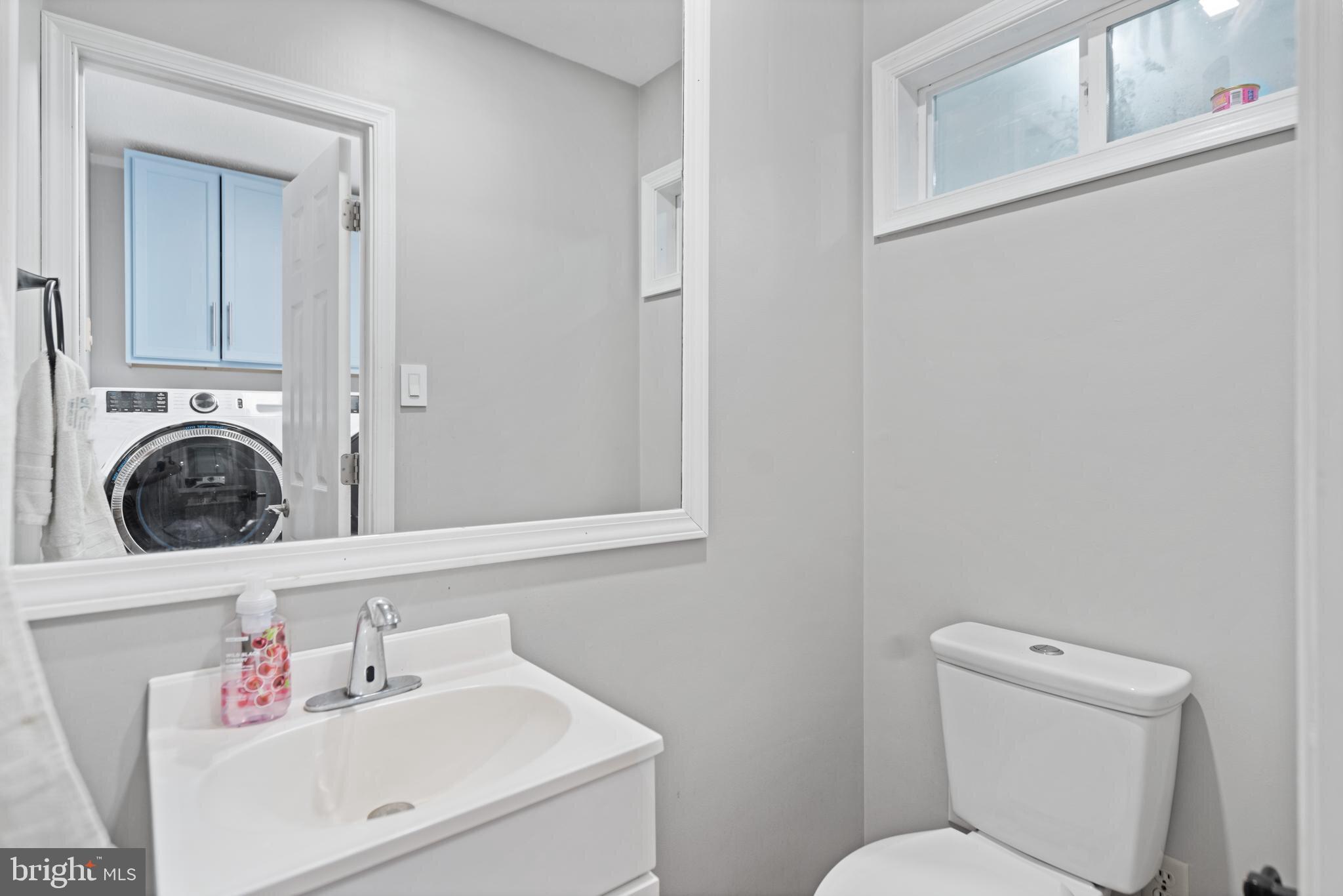 265 Slate Lane Stephenson, VA 22656 - Photo 12 of 29 a bathroom with a toilet sink and mirror