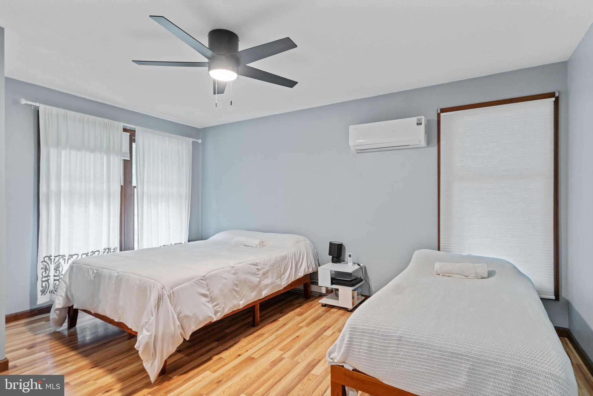 265 Slate Lane Stephenson, VA 22656 - Photo 15 of 29 a bedroom with a bed and a ceiling fan