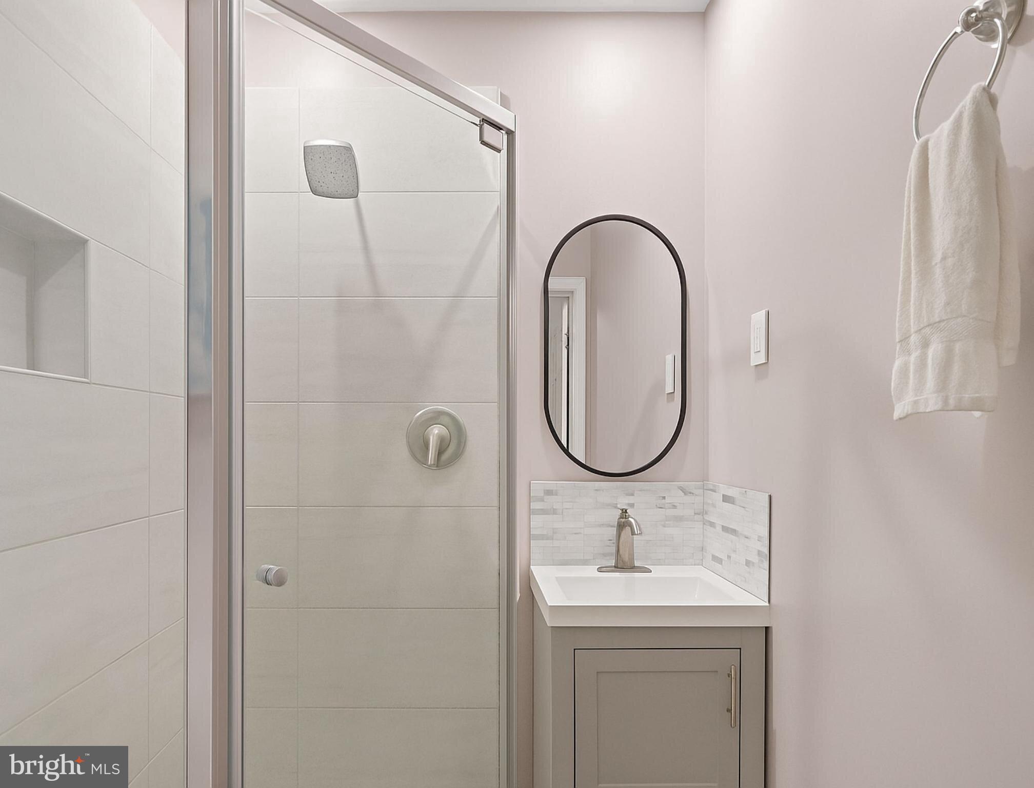 265 Slate Lane Stephenson, VA 22656 - Photo 16 of 29 a bathroom with a sink and a mirror