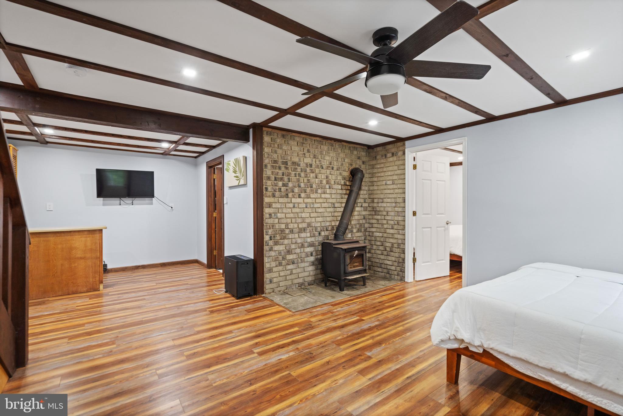 265 Slate Lane Stephenson, VA 22656 - Photo 20 of 29 a bedroom with a bed and wooden floor