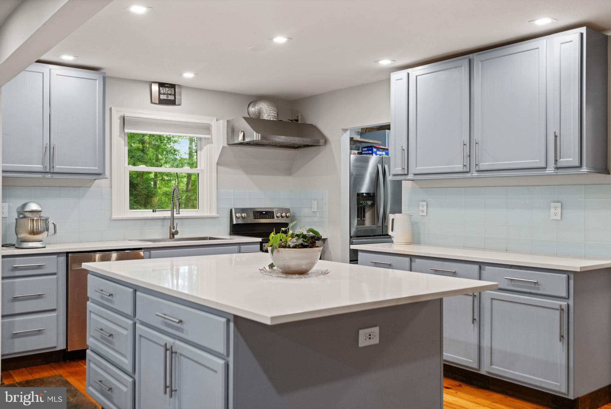 265 Slate Lane Stephenson, VA 22656 - Photo 2 of 29 a kitchen with a sink cabinets and window