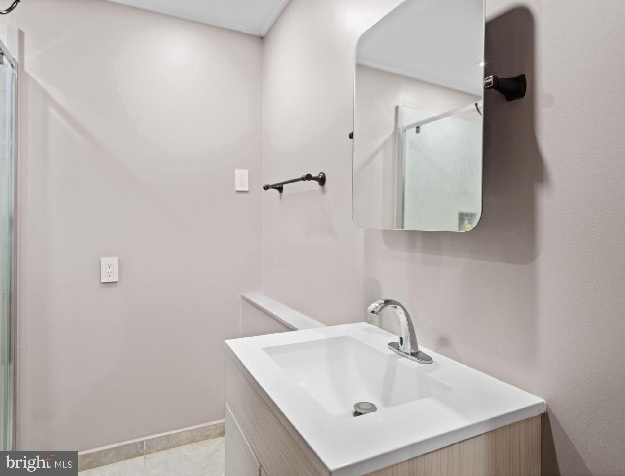265 Slate Lane Stephenson, VA 22656 - Photo 24 of 29 a bathroom with a sink and mirror