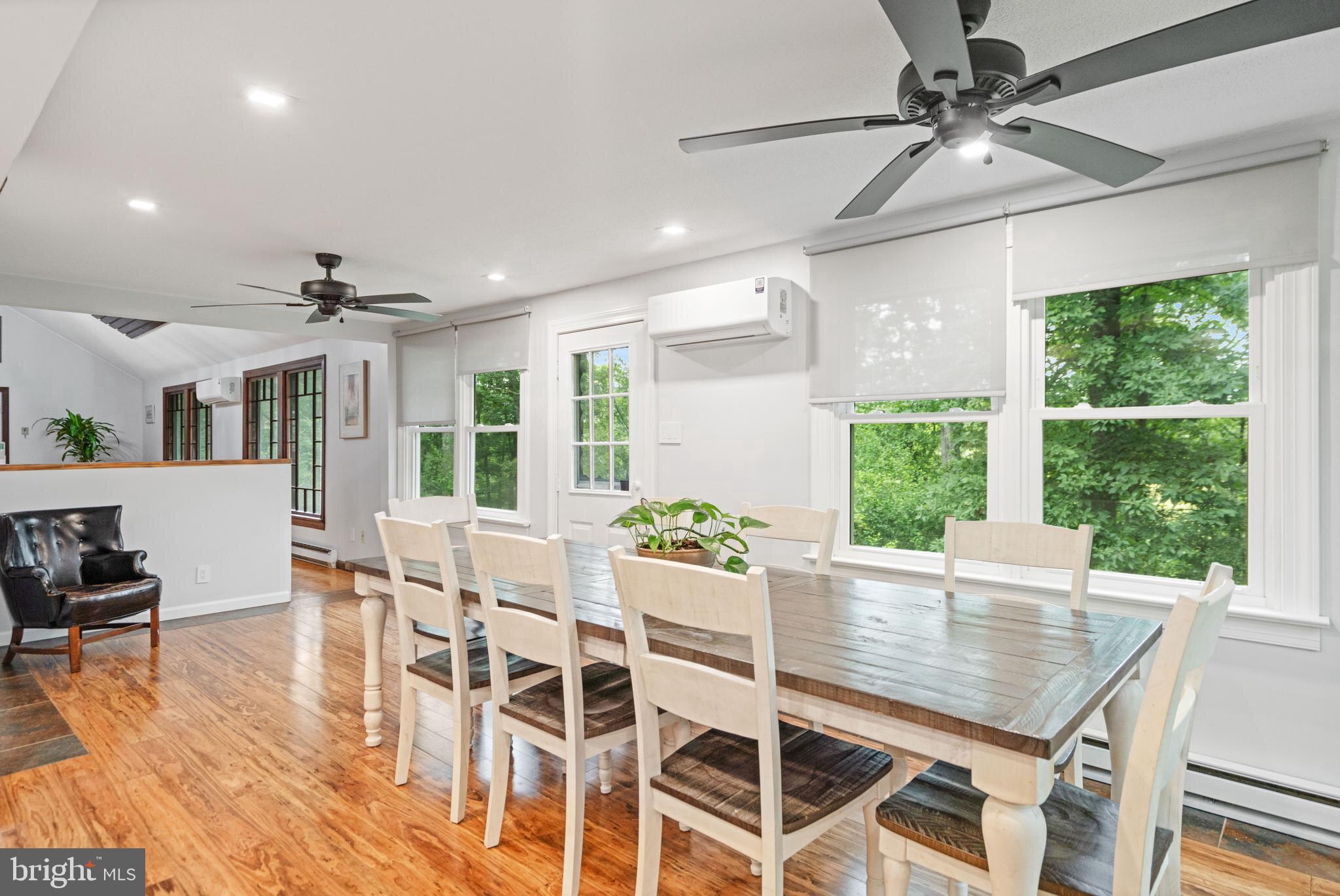 265 Slate Lane Stephenson, VA 22656 - Photo 3 of 29 a dining room with furniture a chandelier and wooden floor