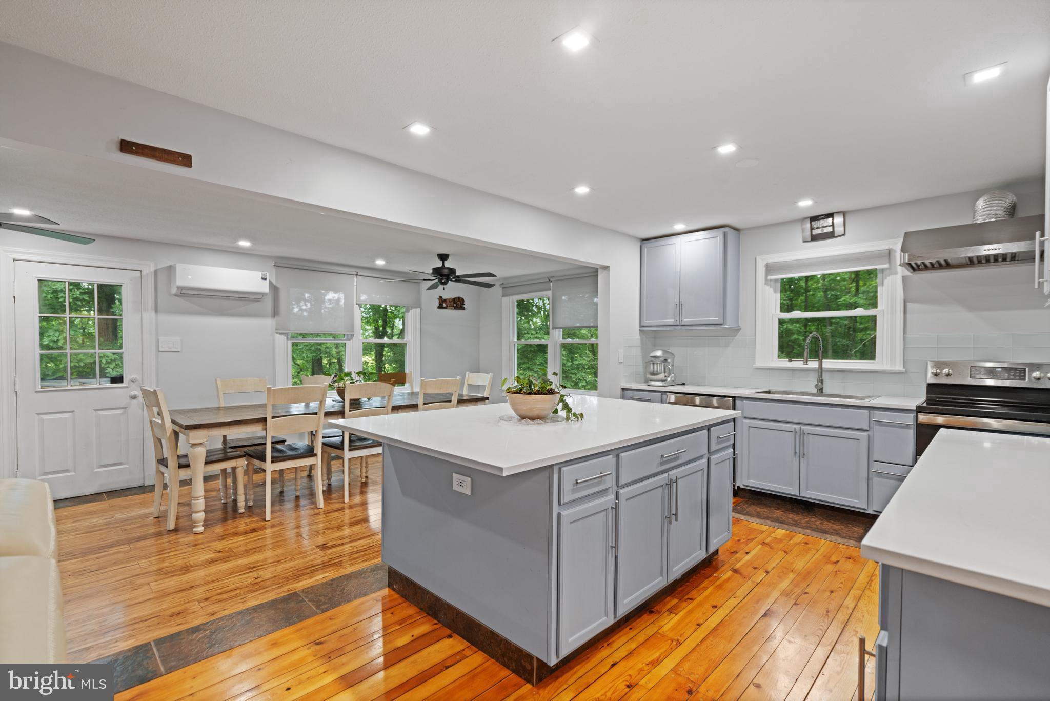 265 Slate Lane Stephenson, VA 22656 - Photo 9 of 29 a kitchen with a sink stove and wooden cabinets