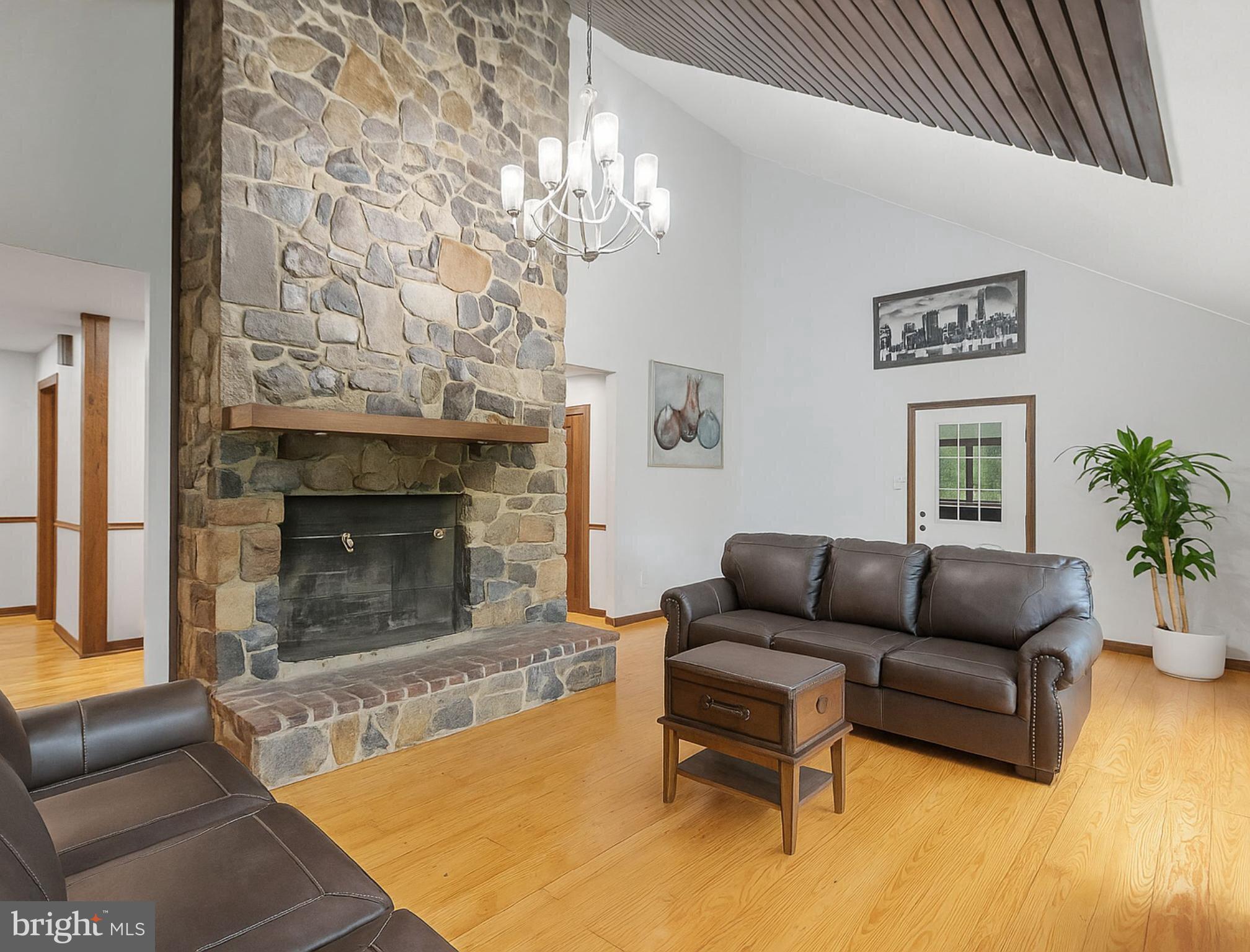 265 Slate Lane Stephenson, VA 22656 - Photo 10 of 29 a living room with furniture and a fireplace