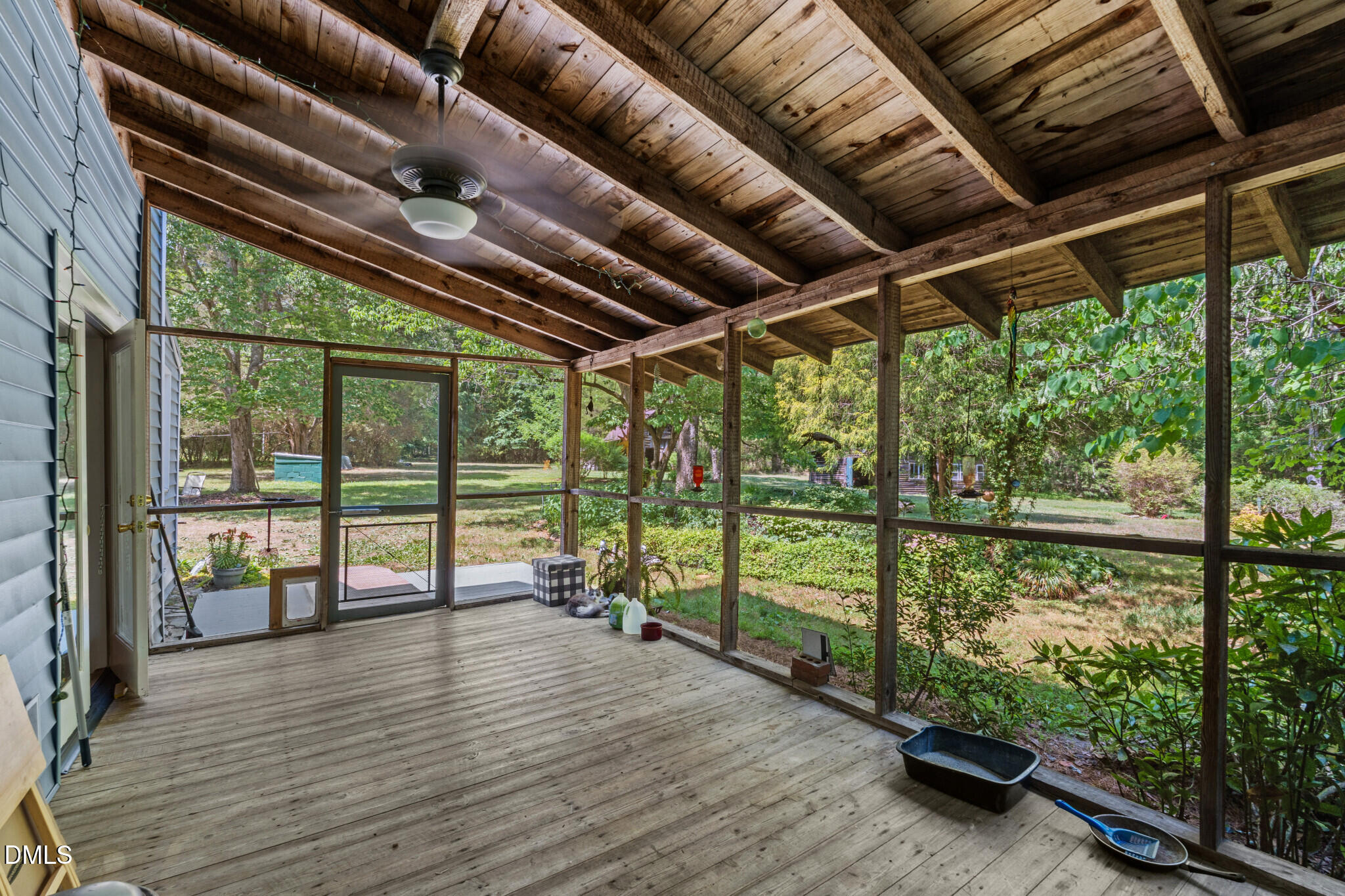 3415 Mt Willing Road Efland, NC 27243 - Photo 21 of 36 a view of a porch with wooden floor