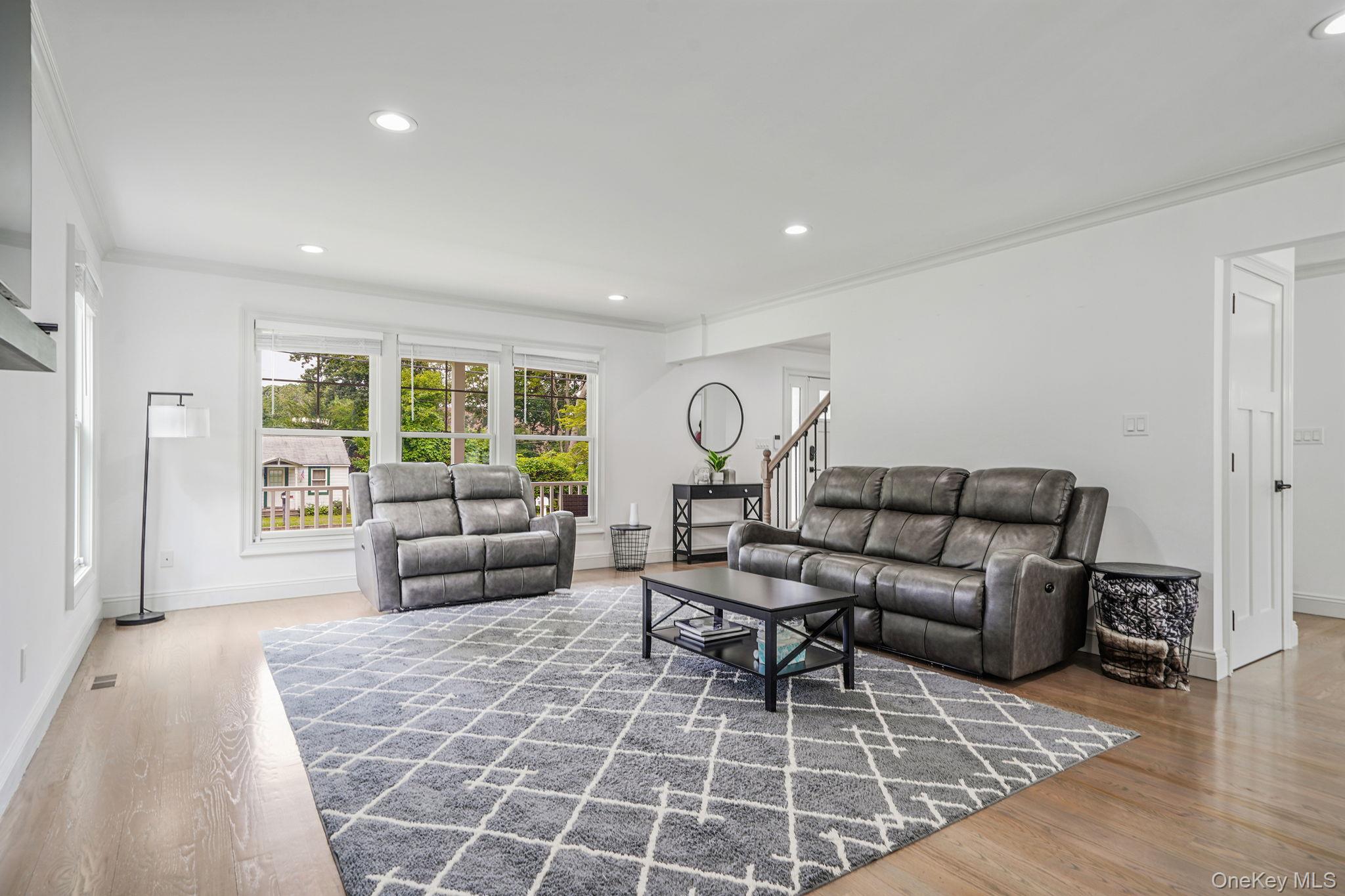 122 4th Street St. James, NY 11780 - Photo 6 of 36 a living room with furniture and a couch