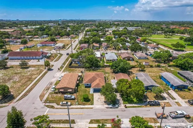 an aerial view of residential houses with outdoor space