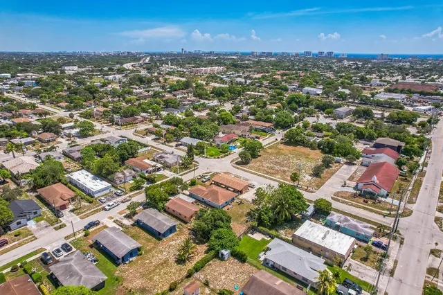 an aerial view of residential houses with outdoor space
